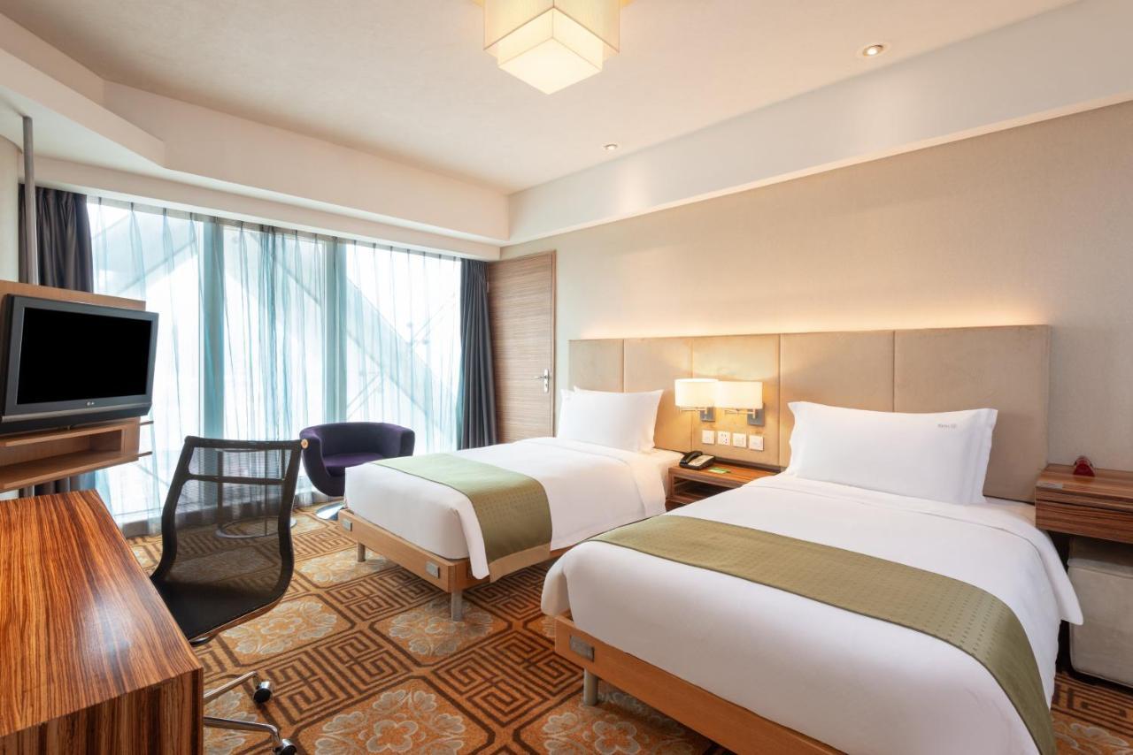 Holiday Inn Binhai Tianjin Quarto foto